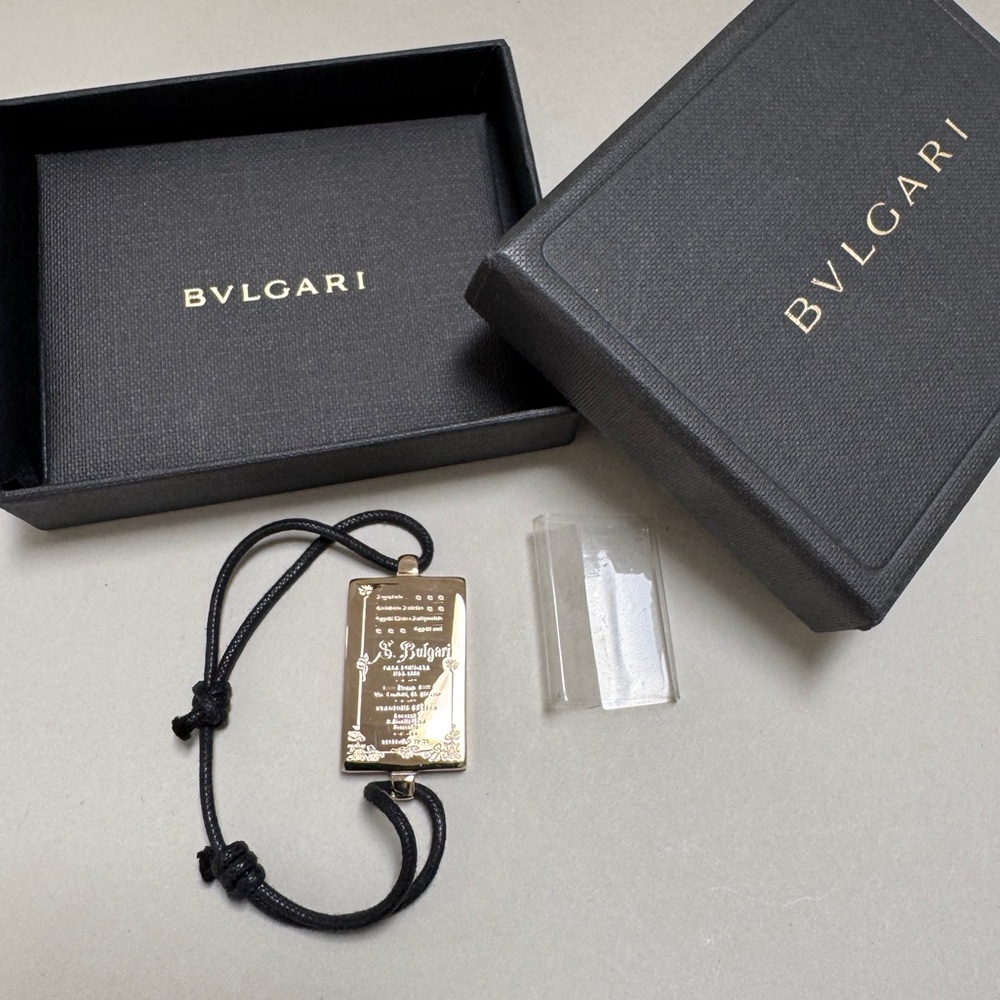 Bvlgari Gold Plaque Bracelet with Black Cord
MADE IN ITALY